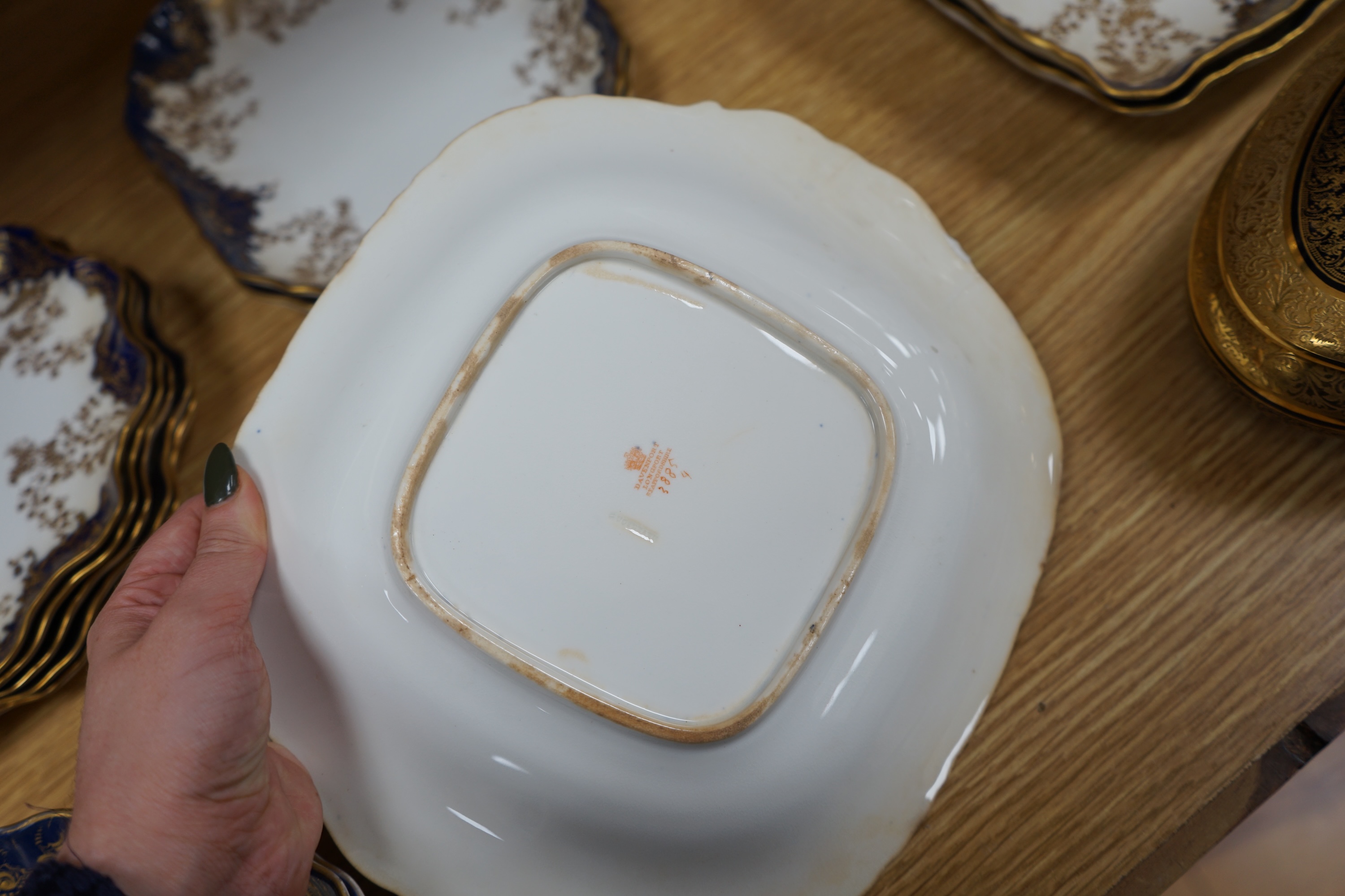 A collection of porcelain to include a Royal Doulton part dessert set, a Limoges gilt oval box and cover and a similar Davenport dish, largest 26cm wide. Condition - mostly fair